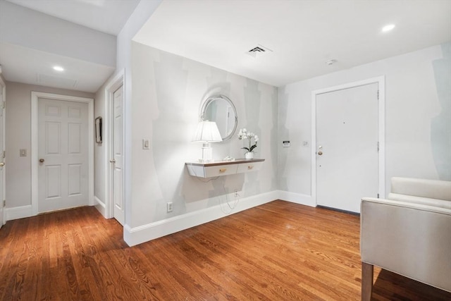 foyer entrance with hardwood / wood-style flooring