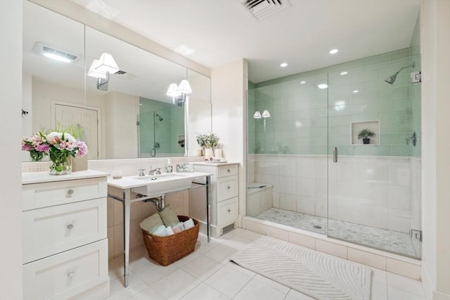 bathroom featuring tile patterned flooring and a shower with door