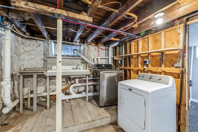 laundry room with independent washer and dryer