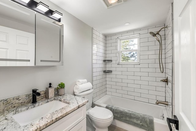 full bath with toilet, vanity, and shower / bath combination