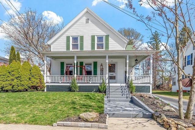 country-style home featuring a porch and a front yard