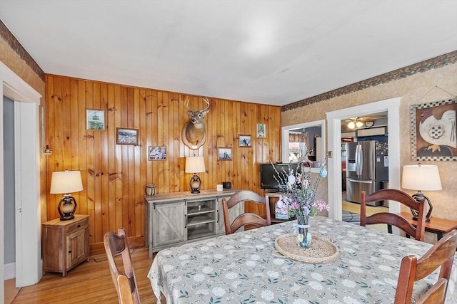 dining area with light wood-style floors