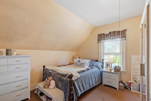carpeted bedroom with vaulted ceiling