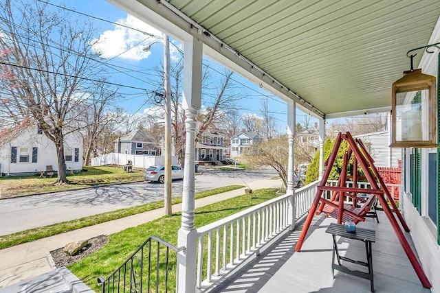 view of patio featuring a porch and a residential view