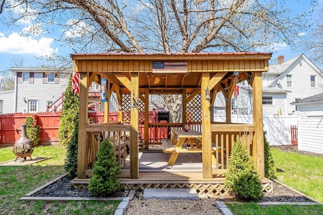 deck featuring a gazebo and fence