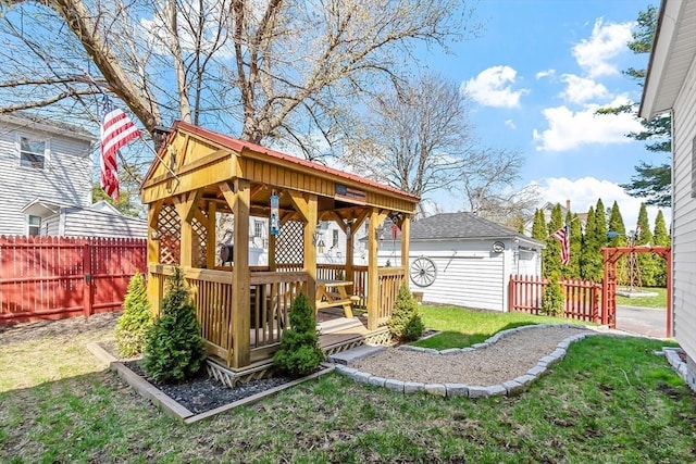view of yard with a fenced backyard and an outbuilding
