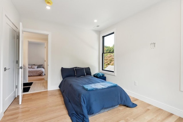 bedroom with light hardwood / wood-style flooring