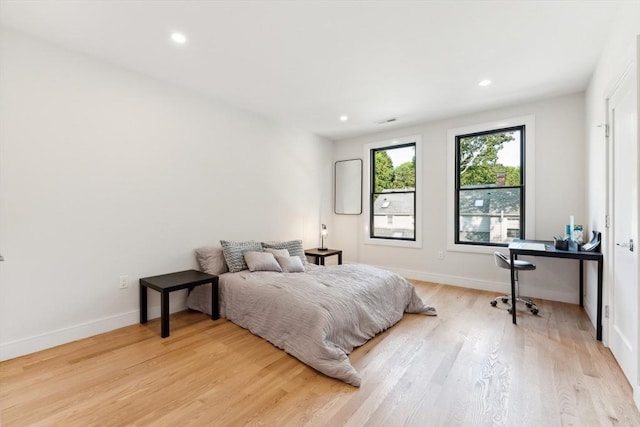 bedroom with light hardwood / wood-style flooring