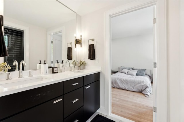 bathroom with vanity and hardwood / wood-style flooring