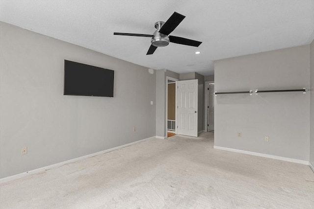 unfurnished bedroom with baseboards, light carpet, a ceiling fan, and recessed lighting