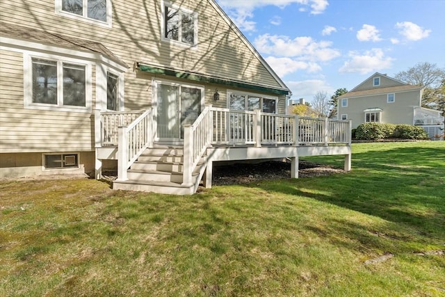 exterior space featuring a lawn and a deck