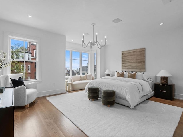565 E Broadway, Boston, MA 02127 - bedroom featuring a chandelier, wood finished floors, and recessed lighting