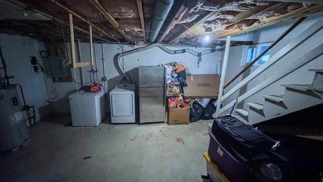 2 Altavesta Cir Unit A, Woburn, MA 01801 - unfinished below grade area featuring washing machine and clothes dryer, water heater, electric panel, and freestanding refrigerator