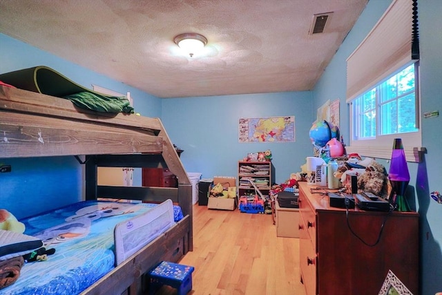 2 Altavesta Cir Unit A, Woburn, MA 01801 - bedroom with wood finished floors and a textured ceiling