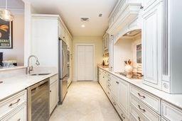interior space with pendant lighting, a sink, and stainless steel appliances