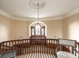 dining room with a chandelier and crown molding