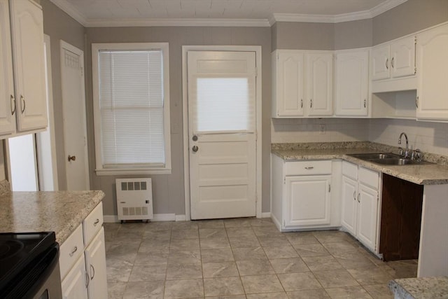 34-36 Glenallen St, Winchendon, MA 01475 - kitchen featuring white cabinetry, light countertops, ornamental molding, and backsplash
