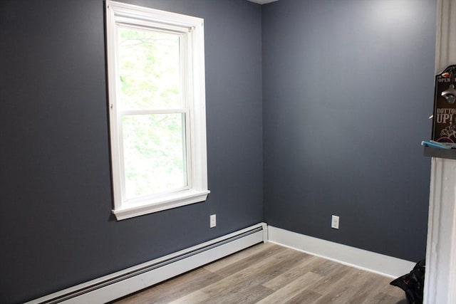 34-36 Glenallen St, Winchendon, MA 01475 - empty room with a baseboard radiator, plenty of natural light, and wood finished floors