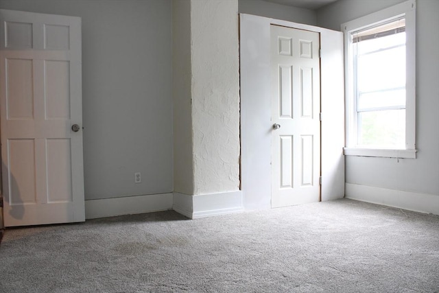 34-36 Glenallen St, Winchendon, MA 01475 - unfurnished bedroom with multiple windows and carpet floors