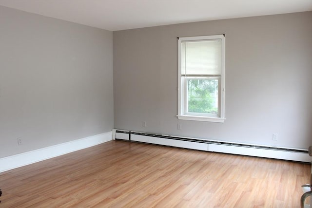 34-36 Glenallen St, Winchendon, MA 01475 - spare room featuring a baseboard heating unit and wood finished floors