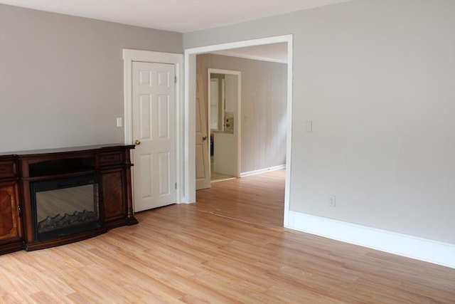 34-36 Glenallen St, Winchendon, MA 01475 - unfurnished living room featuring light wood-style flooring and a fireplace