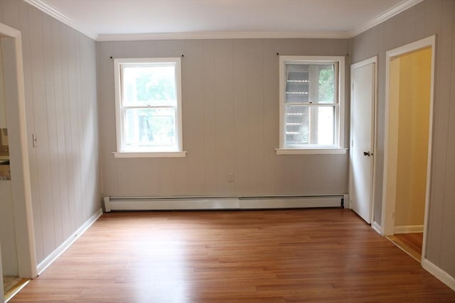 34-36 Glenallen St, Winchendon, MA 01475 - empty room with a baseboard radiator, light wood-style floors, and ornamental molding