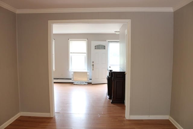 34-36 Glenallen St, Winchendon, MA 01475 - hall featuring wood finished floors, ornamental molding, and a baseboard radiator