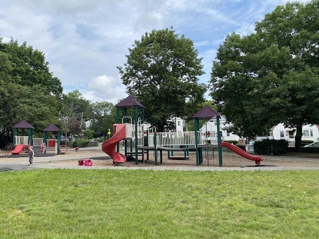 community jungle gym with a lawn