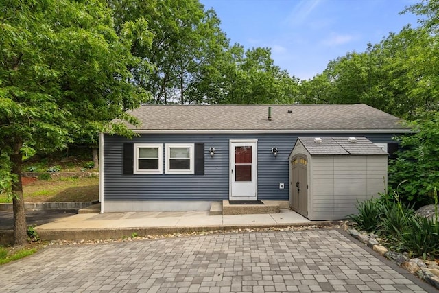 17 Chandler Rd, Malden, MA 02148 - view of front facade featuring a patio and a shingled roof