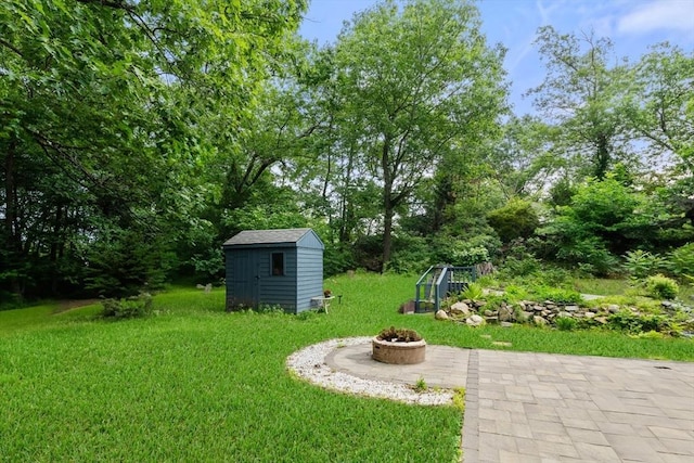 17 Chandler Rd, Malden, MA 02148 - view of green lawn with a fire pit and a patio