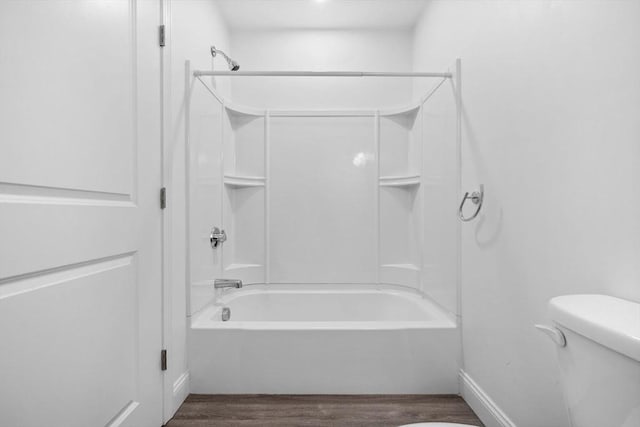 693 Western Ave Unit 404, Lynn, MA 01905 - bathroom featuring wood finished floors, toilet, shower / tub combination, and baseboards