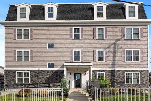 693 Western Ave Unit 404, Lynn, MA 01905 - view of front of property with mansard roof, roof with shingles, and stone siding
