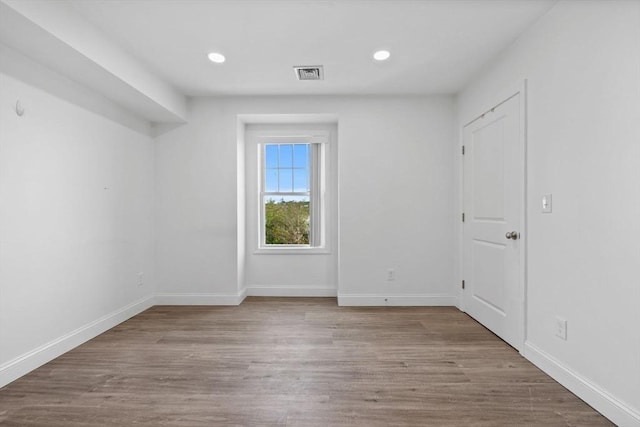 693 Western Ave Unit 404, Lynn, MA 01905 - spare room with wood finished floors, baseboards, and recessed lighting