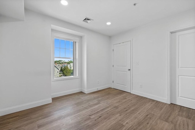 693 Western Ave Unit 404, Lynn, MA 01905 - unfurnished bedroom with wood finished floors, baseboards, and recessed lighting