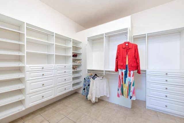 spacious closet featuring light tile patterned flooring