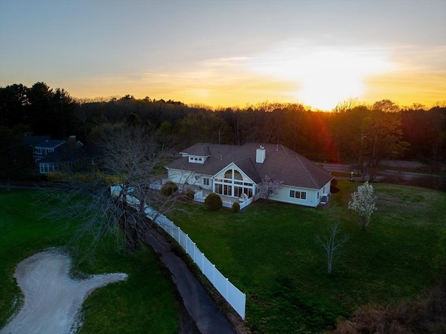 birds eye view of property featuring a view of trees