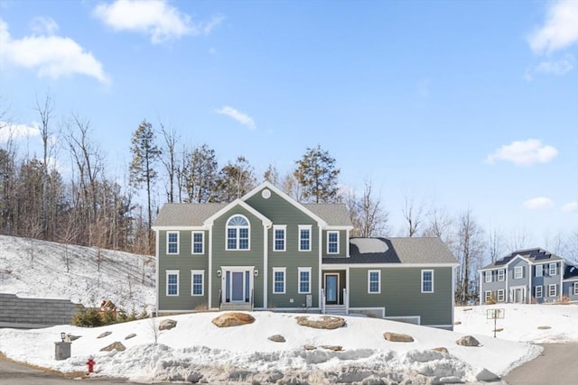 view of front of home featuring fence