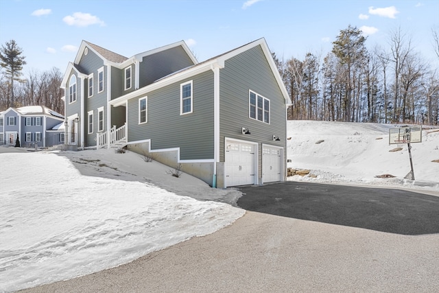 exterior space with driveway and an attached garage