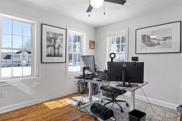 home office with ceiling fan, baseboards, and wood finished floors