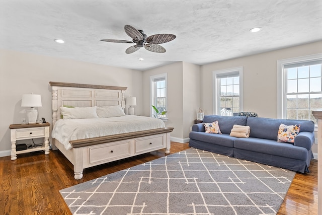 bedroom featuring recessed lighting, dark wood finished floors, baseboards, and ceiling fan