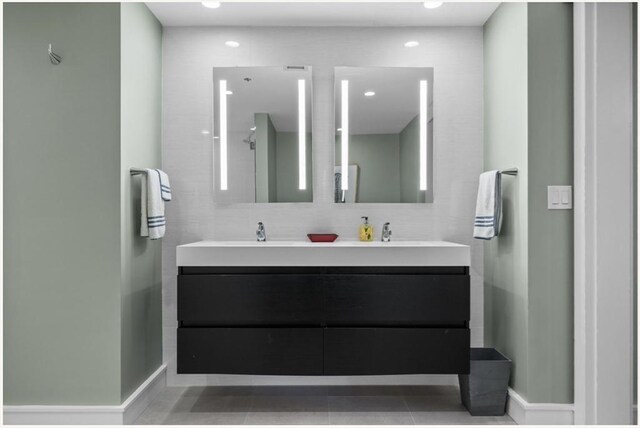 bathroom with tile patterned flooring and vanity