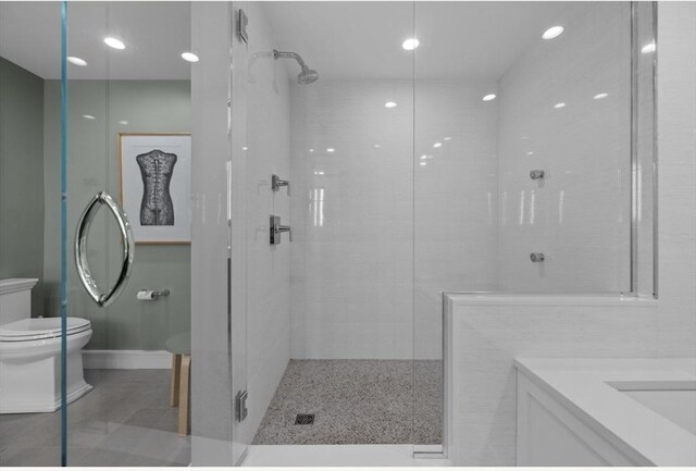 bathroom with vanity, toilet, and an enclosed shower