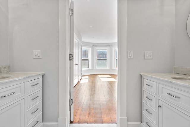 bathroom featuring vanity and hardwood / wood-style flooring