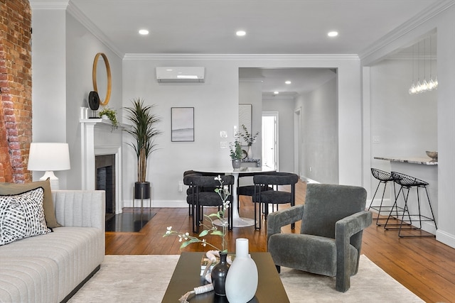 living room with ornamental molding, a wall unit AC, and hardwood / wood-style floors