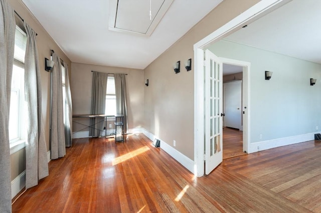 empty room featuring hardwood / wood-style flooring