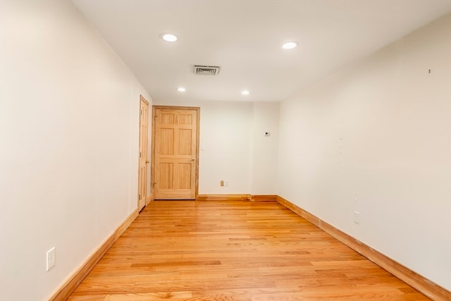 unfurnished room with light hardwood / wood-style floors