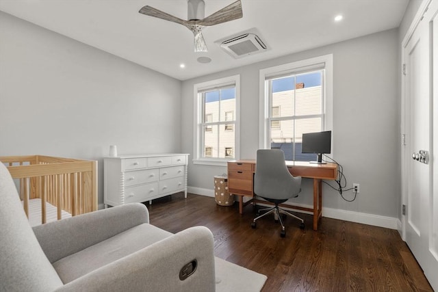 home office with dark wood-type flooring and ceiling fan