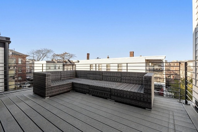 wooden terrace featuring an outdoor hangout area