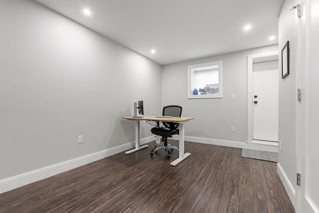 office space with dark hardwood / wood-style flooring