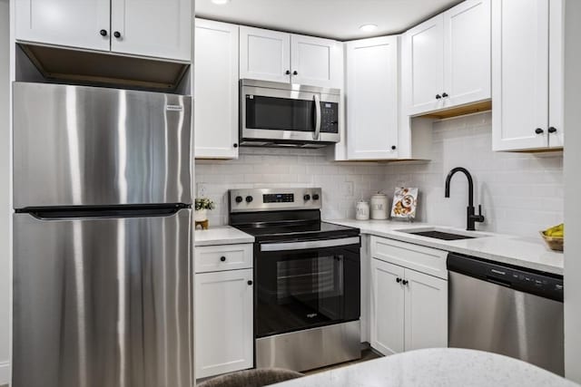 34 Bayview Ter Unit 3, Danvers, MA 01923 - kitchen with stainless steel appliances, a sink, and white cabinetry